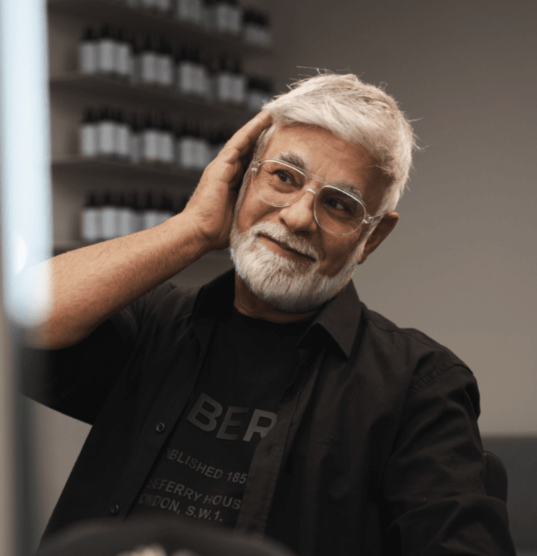 Older man with a stylish system at the salon.