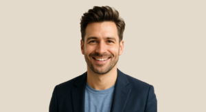 Man with a full, natural-looking head of hair, styled modernly.